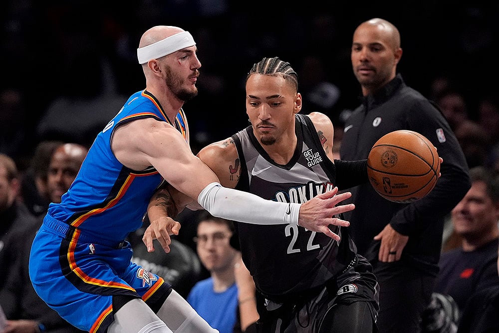 | Photo: AP/Frank Franklin II : NBA 2024-25: Thunder's Alex Caruso defends Nets' Jalen Wilson
