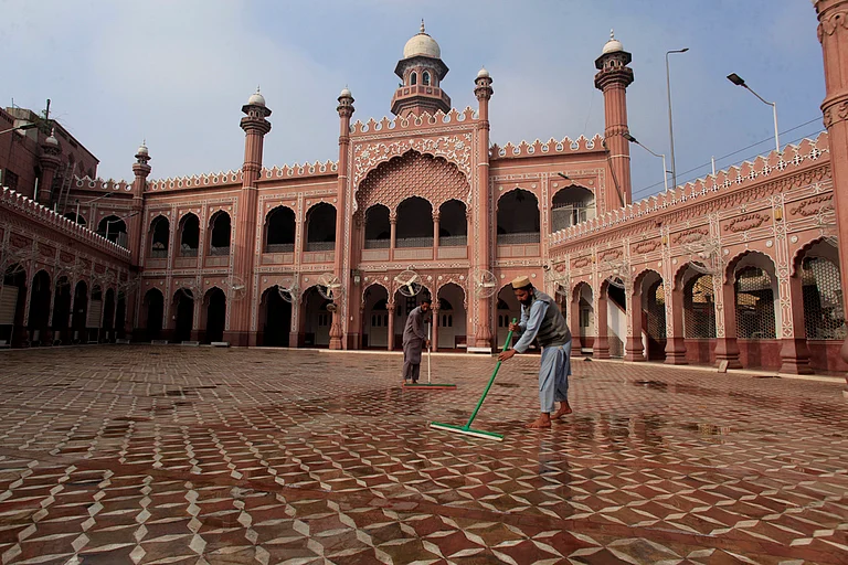 Workers clean a historical Sunehri mosque in preparation for the upcoming Muslim fasting month of Ramadan, in Peshawar, Pakistan, Friday, Feb. 28, 2025. - AP