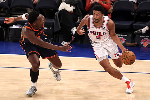 NBA 2024-25: 76ers' Quentin Grimes, right, dribbles the ball 