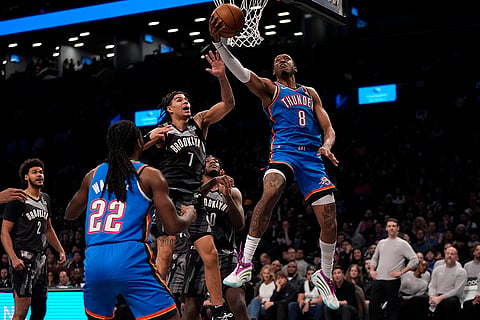 NBA 2024-25: Thunder's Jalen Williams (8) drives past Nets' Killian Hayes