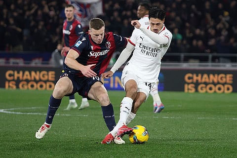 Serie A 2024-25: Bologna's Lewis Ferguson and Milan's Tijjani Reijnders in action 