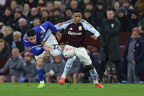 English FA Cup fifth round: Aston Villa's Ezri Konsa and Cardiff City's Rubin Colwill challenge for the ball 