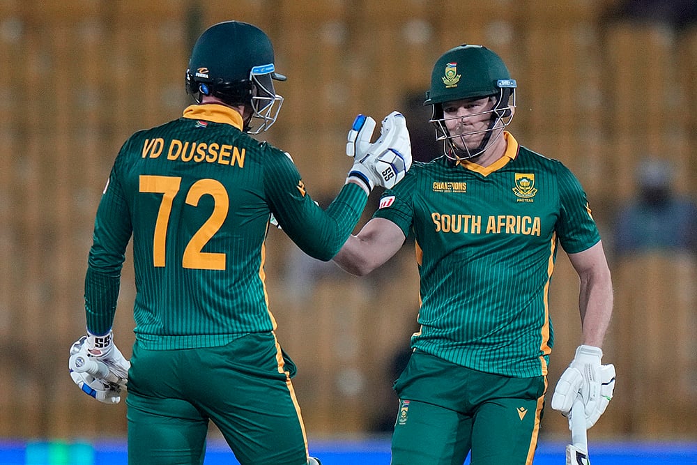 | Photo: AP/Anjum Naveed : Champions Trophy 2025, RSA Vs ENG: South Africa's David Miller celebrates with Rassie van der Dussen after playing winning shot 
