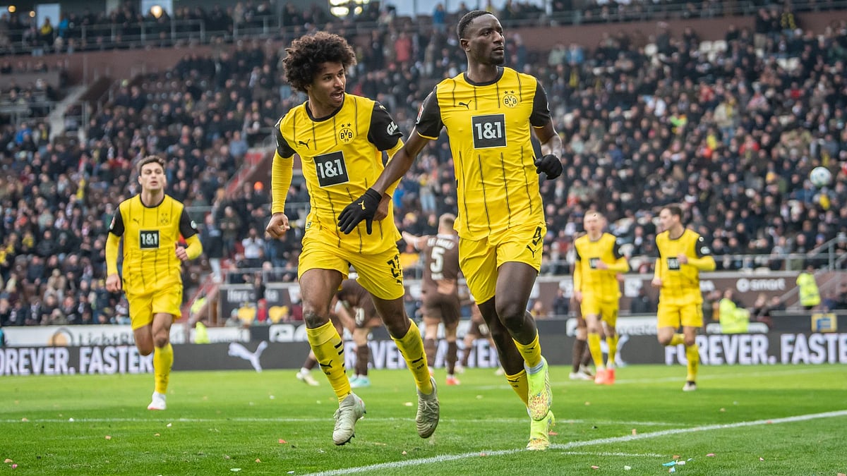 Serhou Guirassy and Karim Adeyemi celebrate Dortmund's opening goal - null