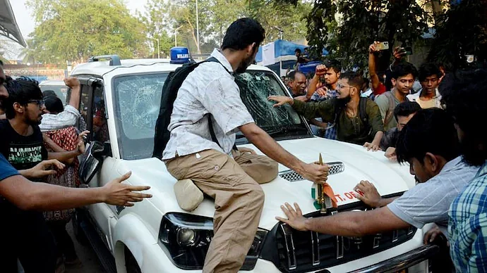 SFI members gheraoed West Bengal Education Minister Bratya Basus car inside JU on Saturday.