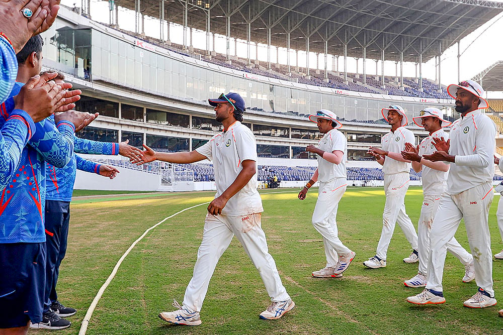 | Photo: PTI : Ranji Trophy final, Kerala v Vidarbha Day 3: Vidarbha's Harsh Dubey being congratulated after he broke the Ranji Trophy record for most wickets in a season