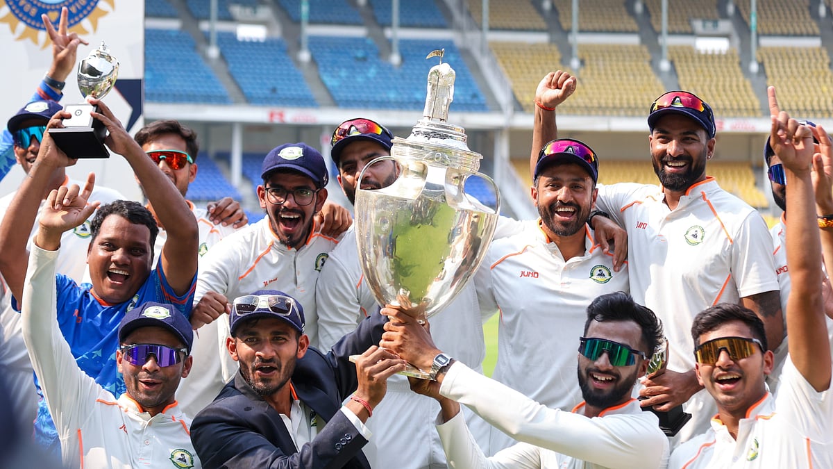 PTI Photo : Vidarbha players pose with the trophy after winning the Ranji Trophy final cricket match against Kerala, in Nagpur.