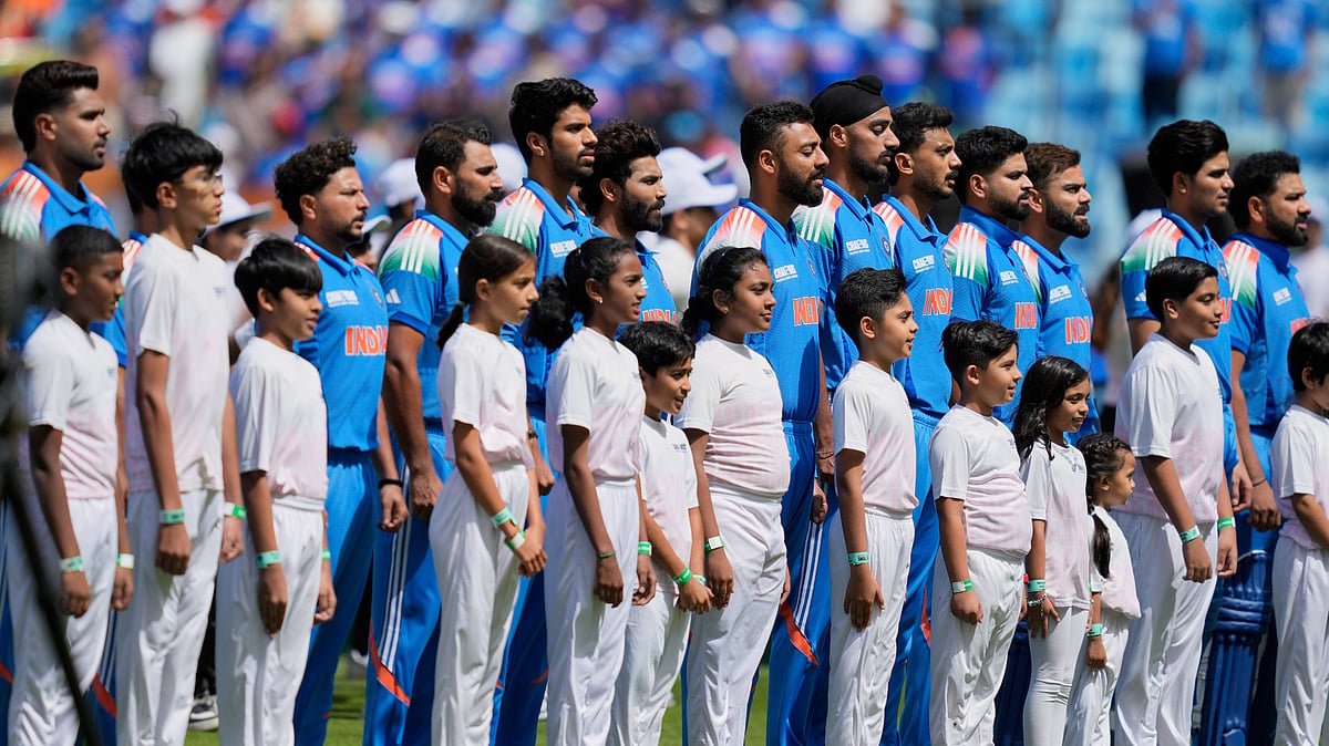 Indian players stand for their national anthem. AP Photo