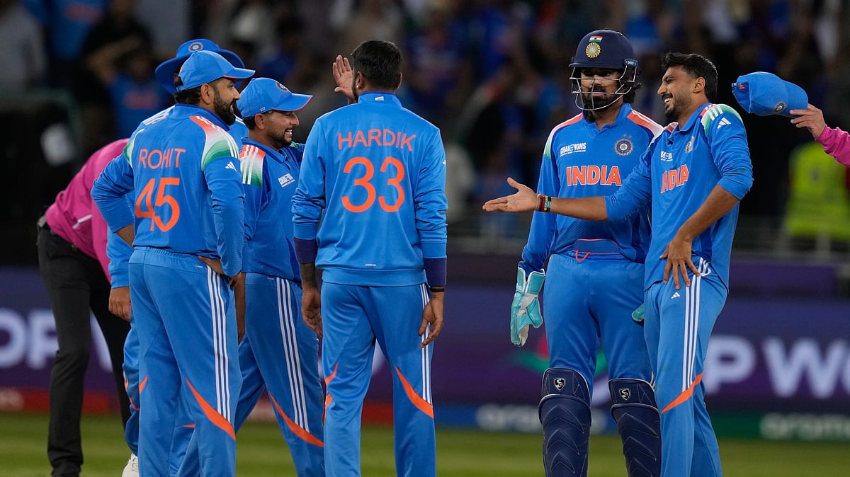 India's Axar Patel celebrates the wicket of New Zealand's Kane Williamson with his team mates during the ICC Champions Trophy cricket match between India and New Zealand at Dubai International Cricket Stadium in Dubai. - AP Photo/Altaf Qadri