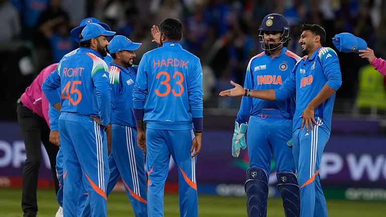 India's Axar Patel celebrates the wicket of New Zealand's Kane Williamson with his team mates during the ICC Champions Trophy cricket match between India and New Zealand at Dubai International Cricket Stadium in Dubai. - AP Photo/Altaf Qadri