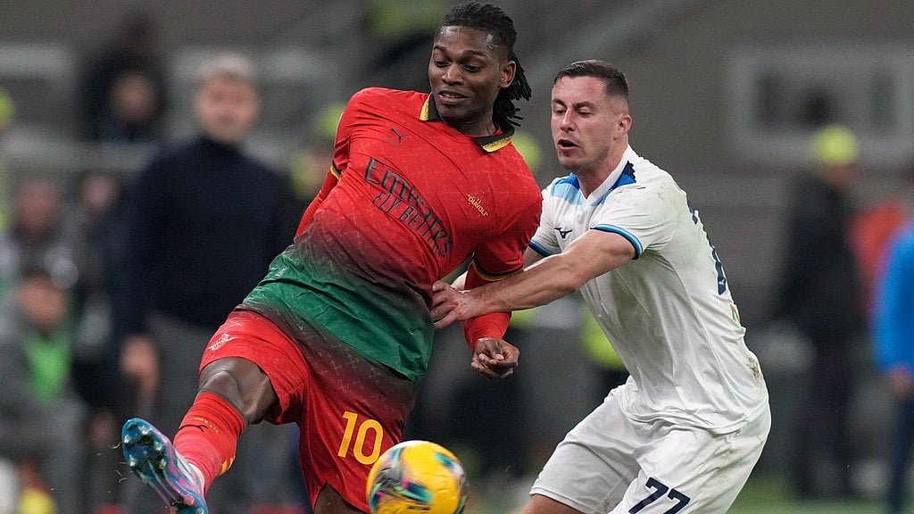 Lazios Adam Marusic, right, challenges AC Milans Rafael Leao