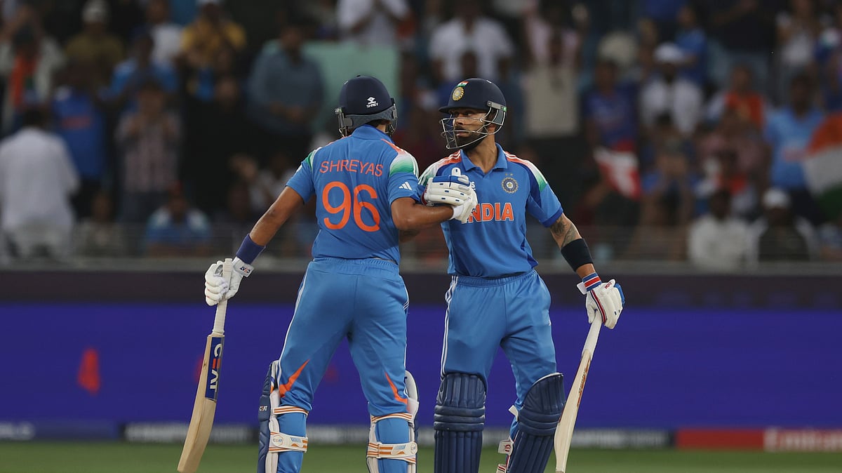 Indias Virat Kohli celebrates after scoring fifty runs. AP Photo