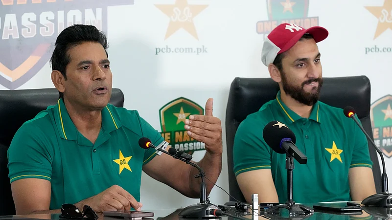 Pakistan interim head coach Aaqib Javed, left, speaks. AP