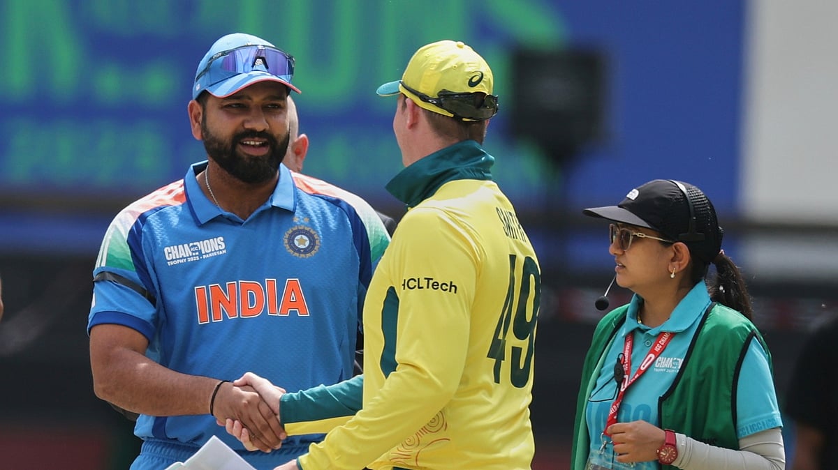 File/AP Photo/Christopher Pike : India's captain Rohit Sharma, left, greets Australia's captain Steve Smith at the toss ahead of the ICC Champions Trophy semifinal cricket match between India and Australia at Dubai International Cricket Stadium in Dubai.