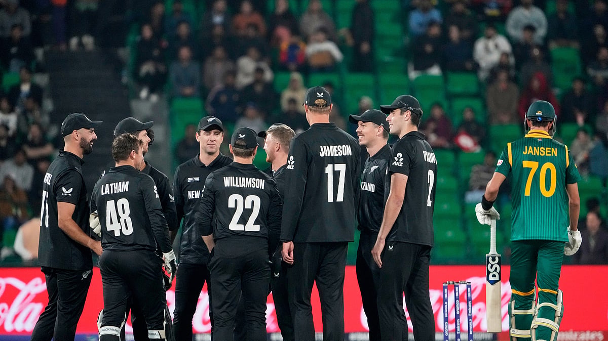 AP Photo/K.M Chaudary : New Zealand's players celebrate the dismissal South Africa's Marco Jansen, right, of during the ICC Champions Trophy semifinal cricket match between New Zealand and South Africa at Gaddafi Stadium in Lahore.
