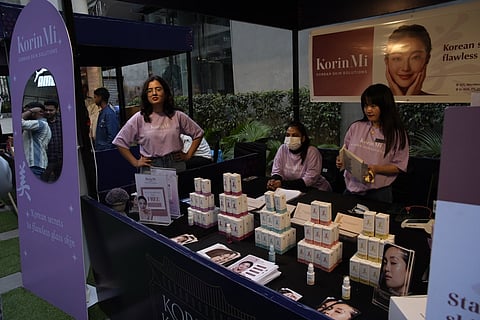 Korean skin clinic KorinMi's stall displaying skincare products at Korean Karnival 2.0 in Worldmark, Gurgaon
