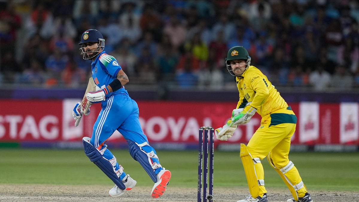 AP Photo/Altaf Qadri : India's Virat Kohli plays a shot during the ICC Champions Trophy semifinal cricket match between India and Australia at Dubai International Cricket Stadium in Dubai.