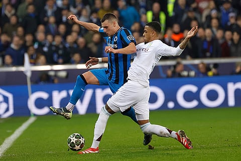 UCL 2024-25 Round Of 16 First leg, Brugge vs Villa: Ferran Jutgla, left, fights for the ball with Ezri Konsa