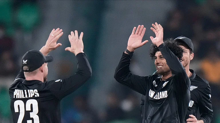 New Zealand's Rachin Ravindra, second right, celebrates with teammate Glenn Phillips the dismissal of South Africa's Aiden Markram during the ICC Champions Trophy semifinal cricket match between New Zealand and South Africa at Gaddafi Stadium in Lahore. - AP Photo/Anjum Naveed