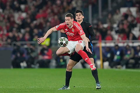 UCL round of 16 first leg, SLB vs FCB: Benfica's Andrea Belotti is challenged by Barcelona's Gerard Martin 