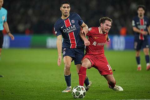 UCL round of 16 first leg, PSG vs LFC: PSG's Achraf Hakimi and Liverpool's Alexis Mac Allister fight for the ball 