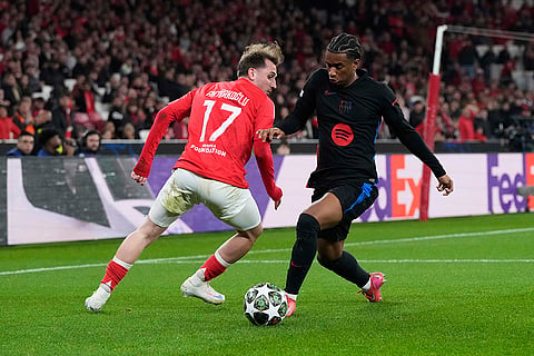 UCL round of 16 first leg, SLB vs FCB: Barcelona's Alejandro Balde runs with the ball past Benfica's Kerem Akturkoglu