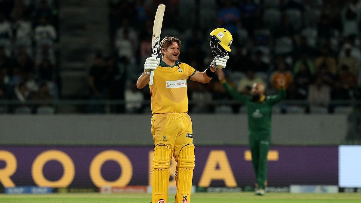 Special Arrangement : Australia Masters captain Shane Watson celebrates his hundred against South Africa Masters.