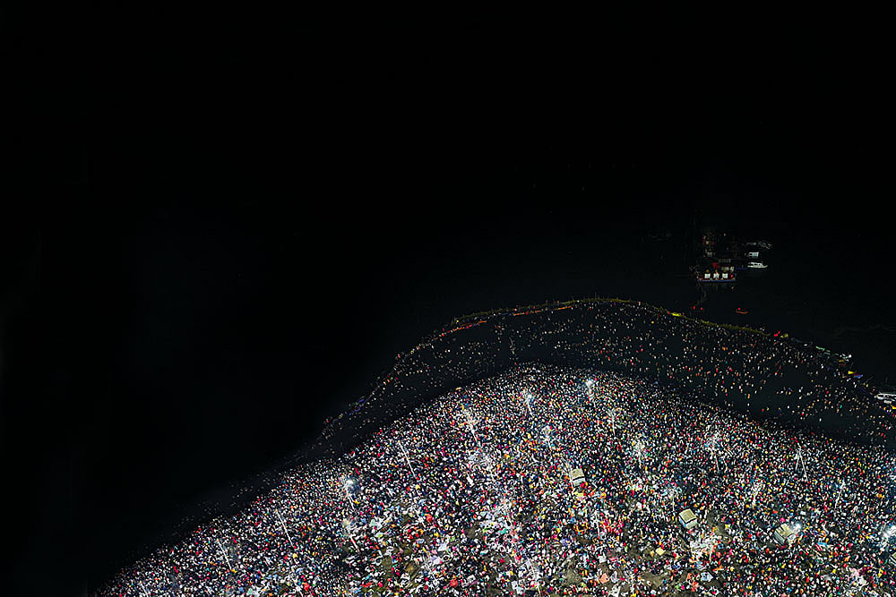 Photo: AP : A Spectacle to Behold: An aerial view of devotees taking a dip at the confluence of the Ganga, the Yamuna and the mythical Saraswati rivers on the final day of the Maha Kumbh Mela in Prayagraj, Uttar Pradesh, on February 26, 2025