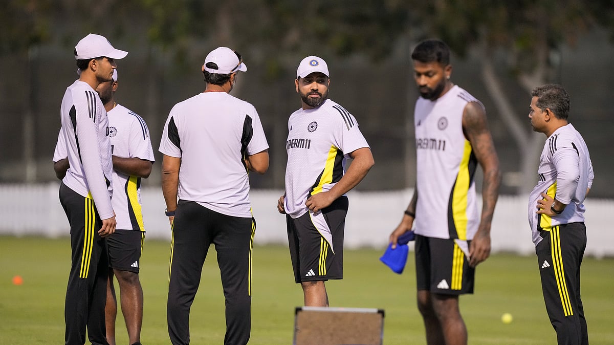 Indias captain Rohit Sharma with teammates. PTI