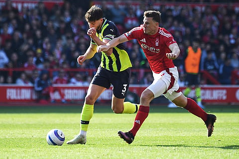 EPL 2024-25, Forest Vs Man City: Nottingham Forest's Chris Wood and Manchester City's Ruben Dias vie for the ball 