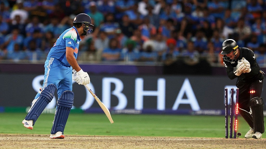 India's captain Rohit Sharma, left, looks on as New Zealand's Tom Latham stumps him out during the ICC Champions Trophy final cricket match between India and New Zealand at Dubai International Cricket Stadium in Dubai, United Arab Emirates, Sunday, March 9, 2025. - AP/Christopher Pike