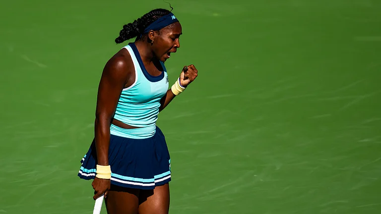 Coco Gauff celebrates after converting her fifth match point - null