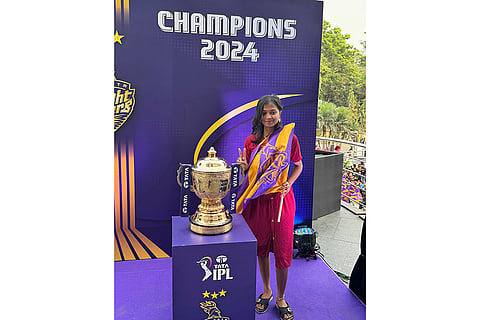 A Kolkata Knight Riders supporter celebrates with the Indian Premier League trophy in Durgapur