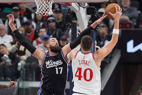 Kings vs Clippers NBA Basketball: Los Angeles Clippers center Ivica Zubac, right, shoots