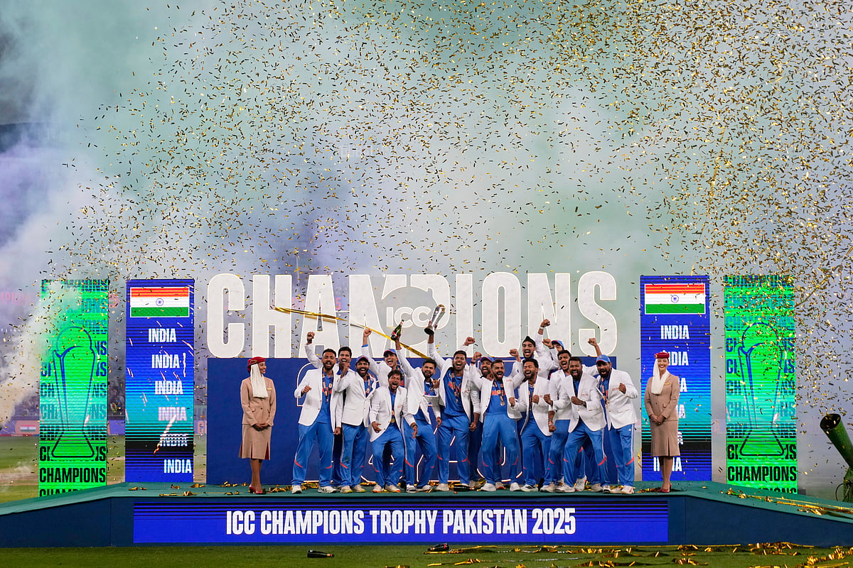(AP Photo/Altaf Qadri) : India's players celebrate after winning the ICC Champions Trophy final cricket match against New Zealand at Dubai International Cricket Stadium in Dubai, United Arab Emirates, Sunday, March 9, 2025.
