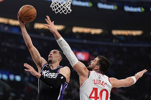 Kings vs Clippers NBA Basketball: Sacramento Kings guard Zach LaVine, left, shoots