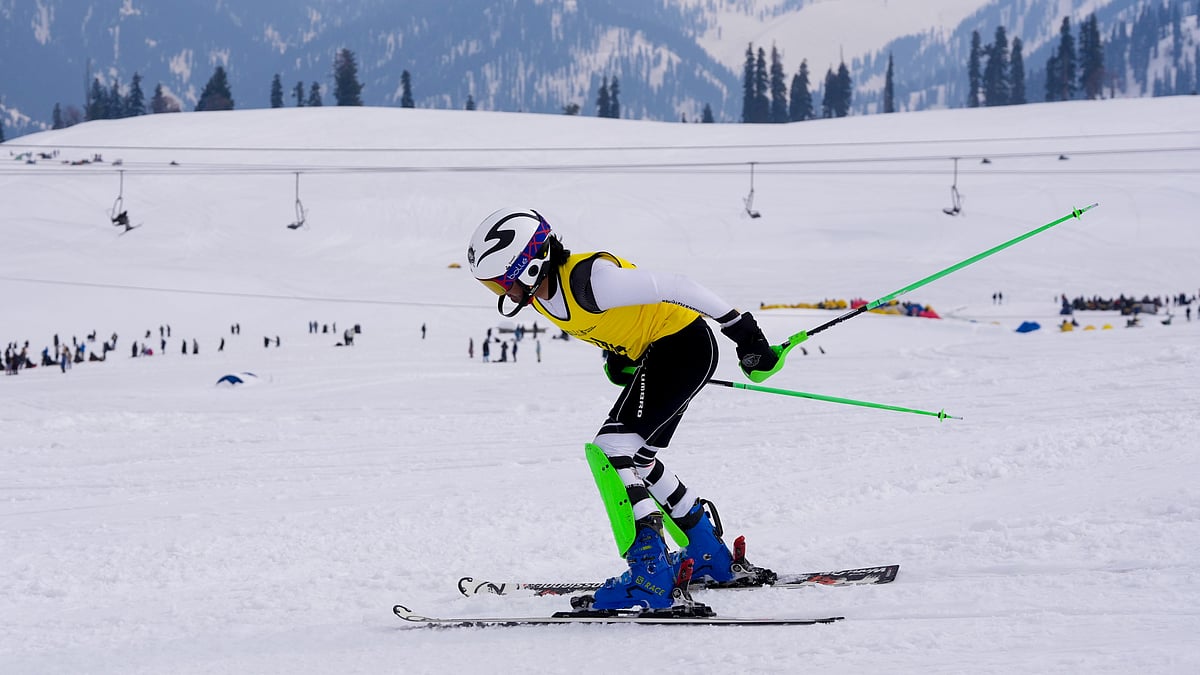 PTI : A participant in action in the snowboard event of Khelo India Winter Games 2025 at Kongdori in Gulmarg.