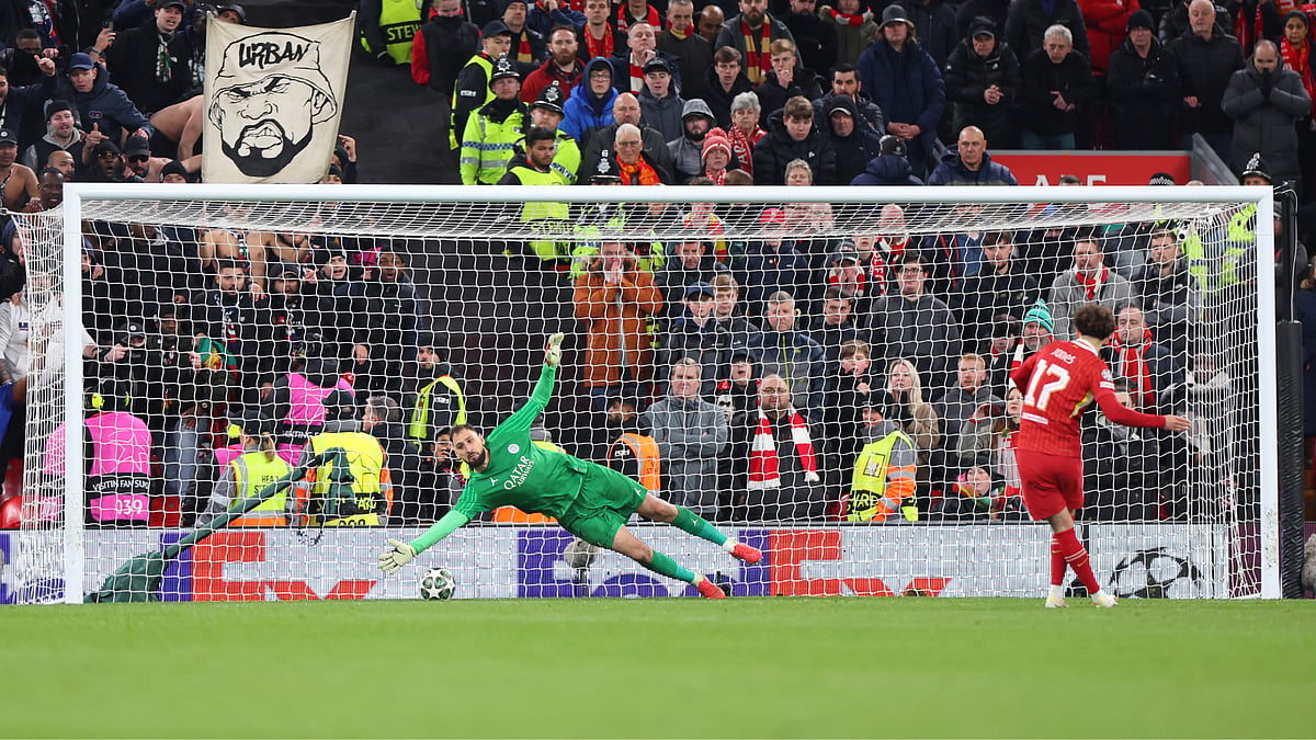 Gianluigi Donnarumma saves from Curtis Jones' penalty