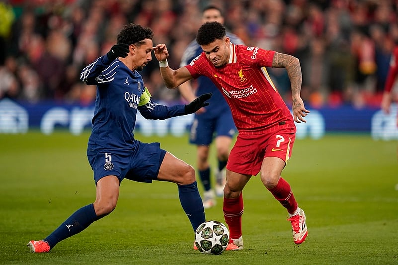 PSGs Marquinhos challenges Liverpools Luis Diaz during the Champions League