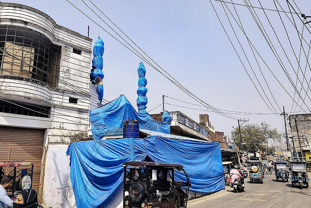 Mosque covered ahead of Holi procession