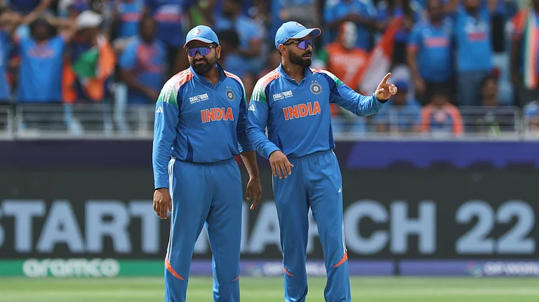 India's Virat Kohli, right, and captain Rohit Sharma react during the ICC Champions Trophy final cricket match between India and New Zealand at Dubai International Cricket Stadium in Dubai. - AP Photo/Christopher Pike