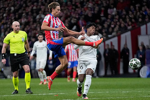 UCL 2024-25, Atletico Madrid and Real Madrid: Atletico Madrid's Marcos Llorente shoots by Real Madrid's Endrick 