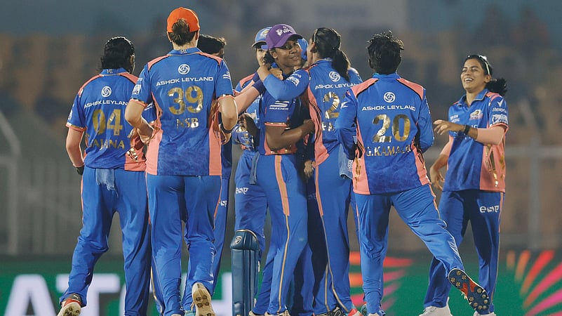 Mumbai Indians celebrate a Gujarat Giants wicket