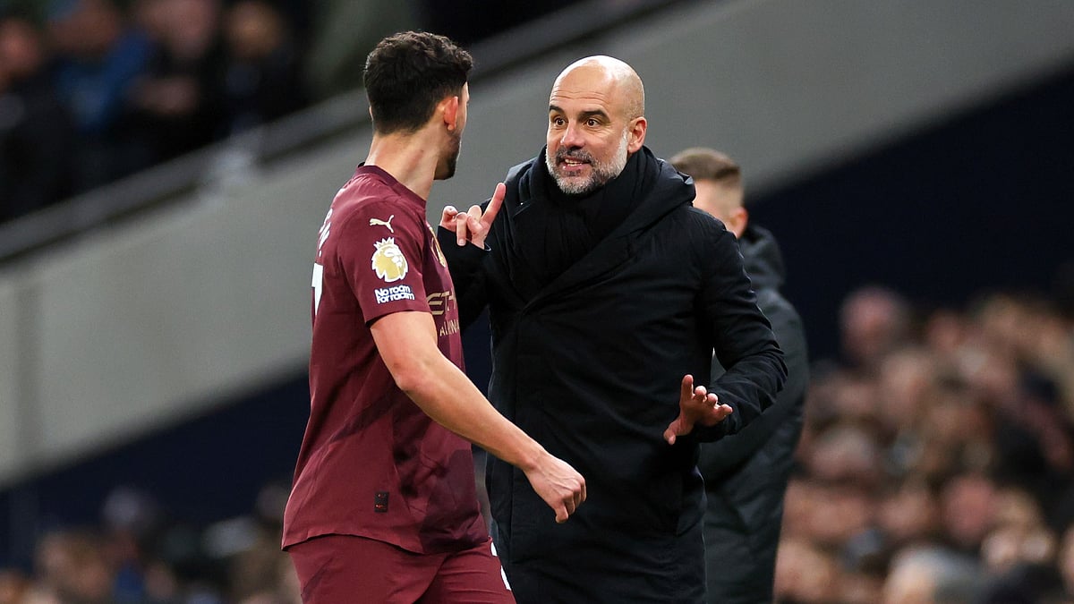 Pep Guardiola and Matheus Nunes. - null