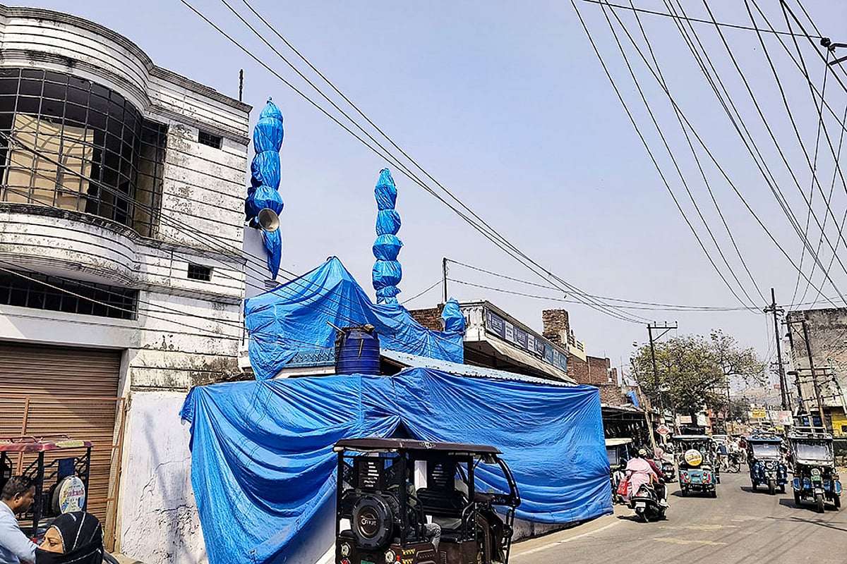A mosque covered in tarpaulin