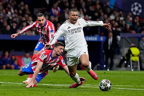 UCL 2024-25, Atletico Madrid and Real Madrid: Atletico Madrid's Clement Lenglet fouls Real Madrid's Kylian Mbappe