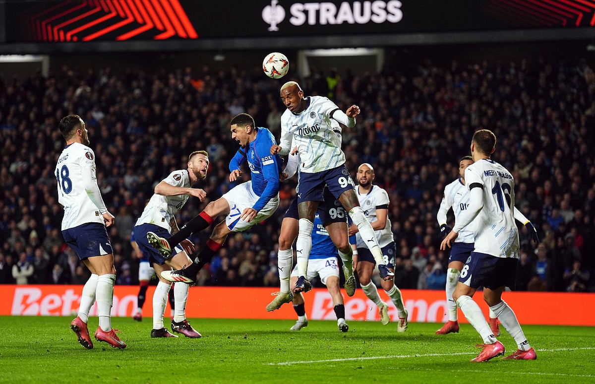 Rangers' Leon Balogun and Fenerbahce's Conceicao Talisca, center right, in action during the Europa League round of sixteen second leg match between Rangers and Fenerbahce at Ibrox Stadium, Glasgow, Scotland, Thursday March 13, 2025.
