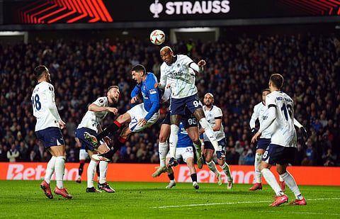 Rangers' Leon Balogun and Fenerbahce's Conceicao Talisca, center right, in action during the Europa League round of sixteen second leg match between Rangers and Fenerbahce at Ibrox Stadium, Glasgow, Scotland, Thursday March 13, 2025.
