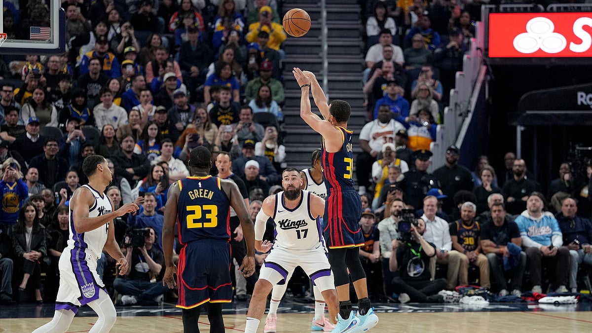 Stephen Curry #30 of the Golden State Warriors shoots a three-point shot over Jonas Valanciunas #17 of the Sacramento Kings during the first half at Chase Center on March 13, 2025 in San Francisco, California