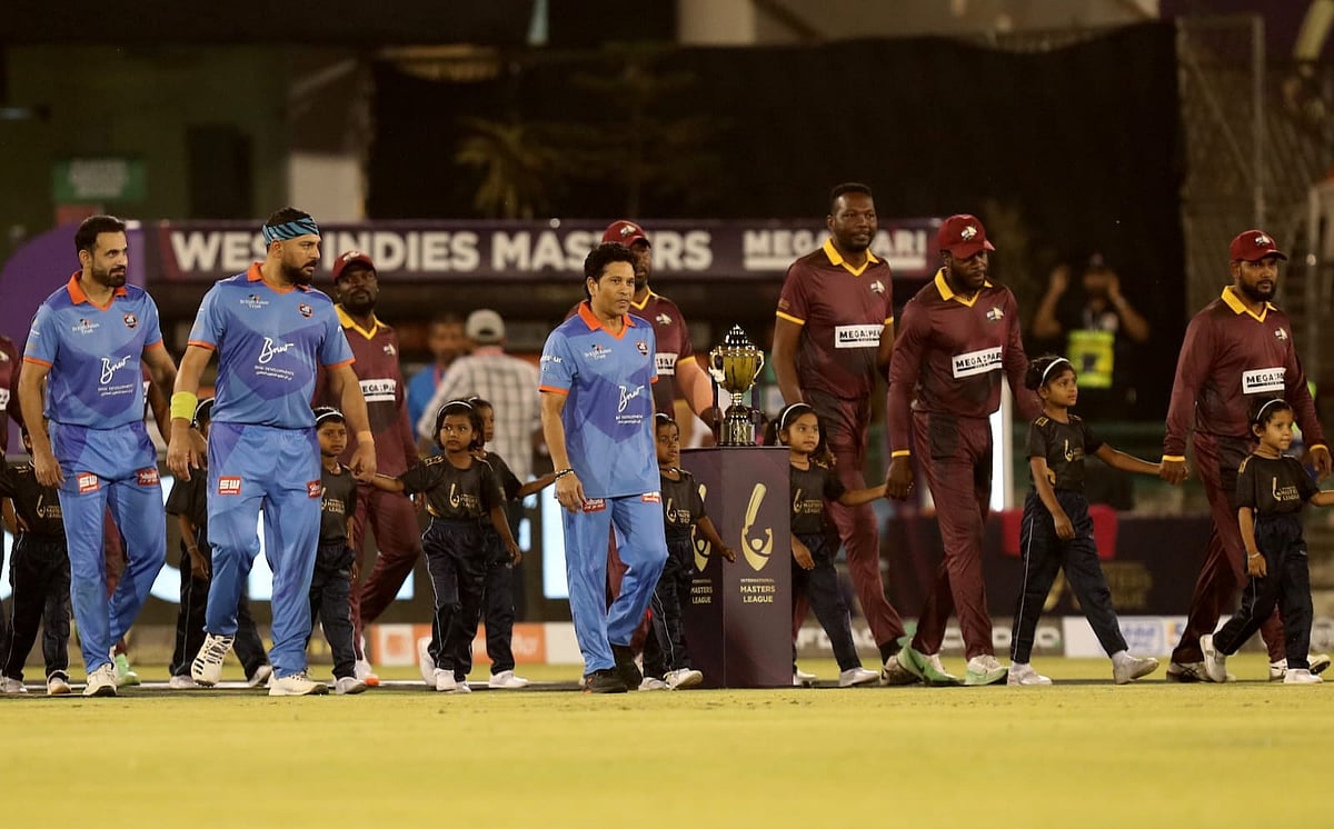 India Masters and West Indies Masters team members walk out